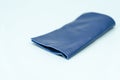 Piece of blue leather and suede cut on white background. Concept and idea of fine leather crafting, handmade, handcrafted