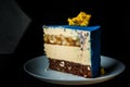 piece of blue mousse cake on white plate
