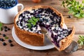 A piece of blueberry pie on wooden table Royalty Free Stock Photo
