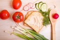 piece of bread, vegetables and dill on a wooden table Royalty Free Stock Photo