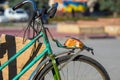 Piece of bread on the trunk of an old bicycle. food and transport. poverty and survival in poor conditions