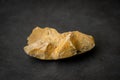 Piece of broken apart gravel stone sharp edged metamorphic stone