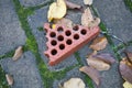 piece of broken red brick on the ground