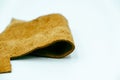 Piece of brown leather and suede cut on white background. Concept and idea of fine leather crafting, handmade, handcrafted
