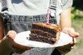 A piece of cake with a blown out candle. A piece of chocolate cake. Candle in chocolate cake. Royalty Free Stock Photo