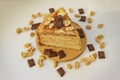 Piece of cake with chocolate and peanuts Royalty Free Stock Photo