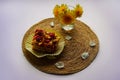 A piece of cake and dandelions on a jute stand Royalty Free Stock Photo
