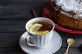 Piece of cake with fruit andcup of tea with lemon Royalty Free Stock Photo