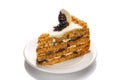 A piece of cake with honey and prunes, highlighted with a white background