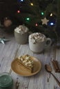 piece of cake and hot chocolate on rustic table on christmas
