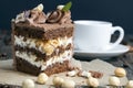 a piece of cake made of chocolate sponge cake cream and caramel with hazelnuts Royalty Free Stock Photo