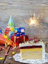 A piece of cake `Napoleon` with a sparkler. Birthday. Side view. Copy space. Royalty Free Stock Photo