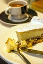 Piece of cake next to a cup of coffee Royalty Free Stock Photo