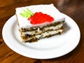 Piece of carrot cake and cappuccino on wooden table Royalty Free Stock Photo