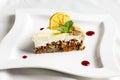 The piece of carrot cake with cream, nuts and dried orange Royalty Free Stock Photo