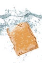 Piece of cartboard falling in water Royalty Free Stock Photo