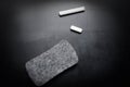 Piece of chalk and eraser on blackboard Royalty Free Stock Photo