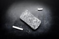 Piece of chalk and eraser on blackboard Royalty Free Stock Photo