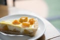 A piece of cheese cake tart with fresh mango, delicious mango ta