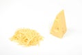 Piece of cheese and heap of grated cheese, isolated on white background.