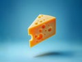 Piece of cheese in a triangle block floating with a blue studio background Royalty Free Stock Photo