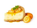 Piece of cheesecake with fresh kumquat and mint Royalty Free Stock Photo