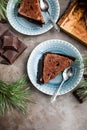 Chocolate cake with chocolate cream and glaze decorations on a wooden board Royalty Free Stock Photo