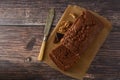 Piece of chocolate cake , fudge or pound cake. Wooden background