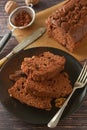 Piece of chocolate cake , fudge or pound cake. Wooden background