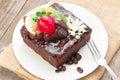 Piece of chocolate cake with icing and fresh berry Royalty Free Stock Photo