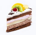 Piece of chocolate cake with icing and fresh fruit isolated on a Royalty Free Stock Photo