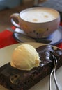 Piece of chocolate cake with a scoop of vanilla ice cream Royalty Free Stock Photo