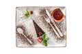 Piece of chocolate cake with strawberry sauce isolated on white background Royalty Free Stock Photo