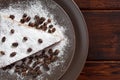 A piece of chocolate cake with sugar and coffee beans. Food, dessert, sweet. Biscuit, brownie, tiramisu, cheesecake. Cook at home Royalty Free Stock Photo