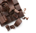 Piece of chocolate with curls on white background Royalty Free Stock Photo