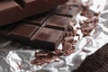 Piece of chocolate on foil, closeup Royalty Free Stock Photo