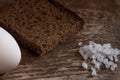 Piece of coarse rye bread with salt and egg Royalty Free Stock Photo