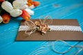 A piece of cotton lace with paper flowers and piece of brown paper Royalty Free Stock Photo