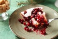 Piece of cranberry Christmas pie on fork over plate Royalty Free Stock Photo