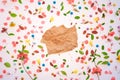 Piece of crumpled paper over colorful springtime background