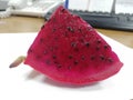 A piece of cut pitaya fruit(dragon fruit ) on the table Royalty Free Stock Photo