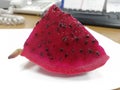 A piece of cut pitaya fruit(dragon fruit ) on the table Royalty Free Stock Photo