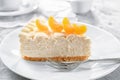 Piece of delicious cheesecake with tangerine Royalty Free Stock Photo