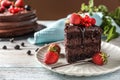 Piece of delicious chocolate cake with berries on plate Royalty Free Stock Photo