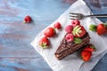 Piece of delicious chocolate cake with berries on wooden table Royalty Free Stock Photo