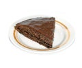 Piece of delicious chocolate cake on a plate isolated Royalty Free Stock Photo