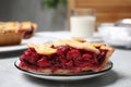 Piece of delicious fresh cherry pie on light grey marble table, closeup Royalty Free Stock Photo