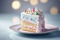 A piece of a delicious, frosted birthday cake adorned with a decorative design and pastel colors