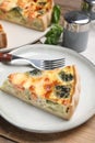 Piece of delicious homemade salmon quiche with broccoli and fork on plate Royalty Free Stock Photo