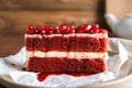 Piece of delicious pomegranate cake on plate, closeup